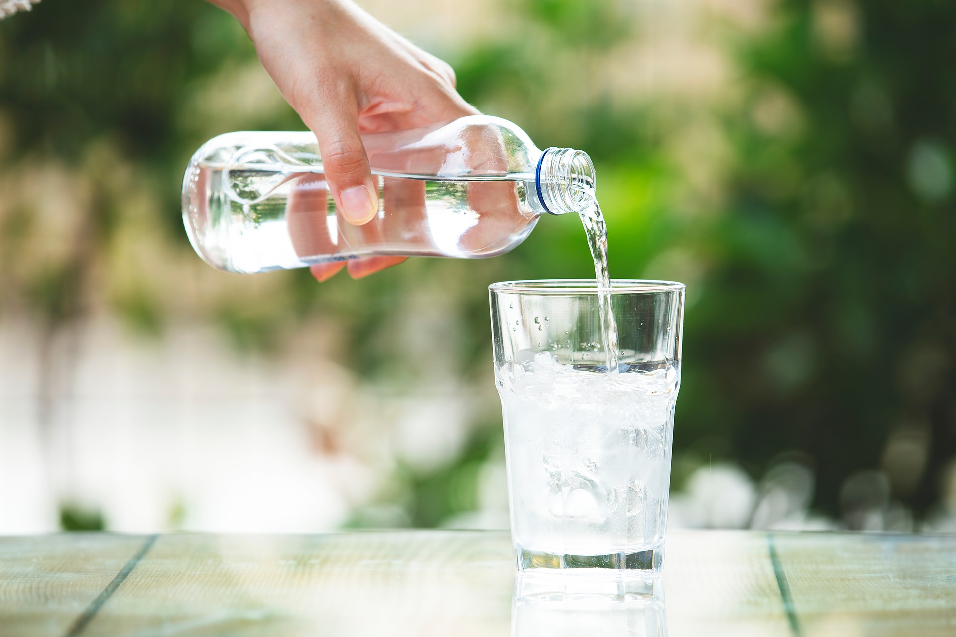 Pouring water into a glass